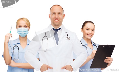 Image of group of smiling doctors with clipboard