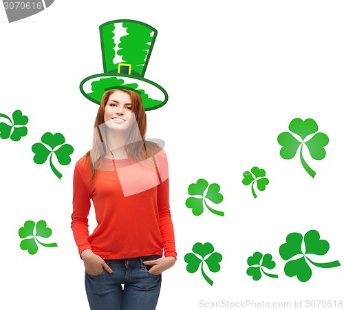 Image of smiling teen girl in green top hat with shamrock