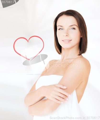 Image of beautiful woman standing in towel