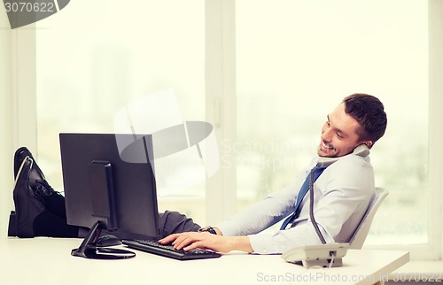 Image of smiling businessman or student with computer