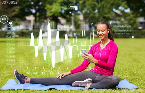 Image of smiling african american woman with smartphone