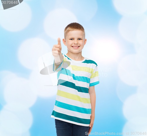 Image of little boy in casual clothes with arms crossed