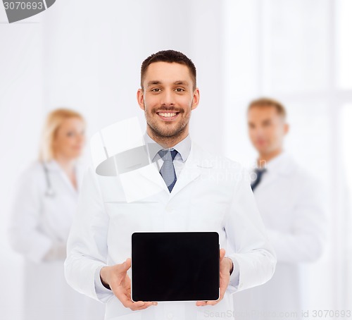 Image of smiling male doctor with tablet pc