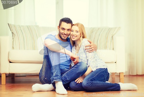 Image of smiling happy couple at home