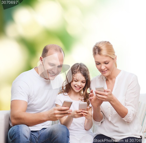 Image of happy family with smartphones