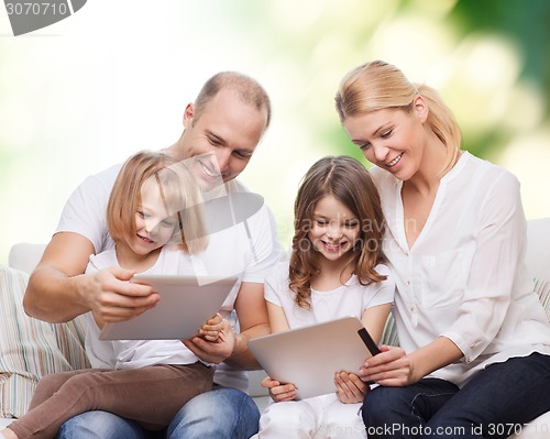 Image of happy family with tablet pc computers