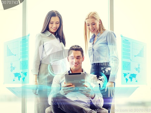 Image of business team working with tablet pc in office