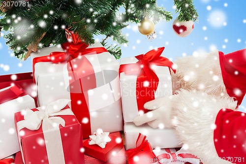 Image of close up of santa claus with presents