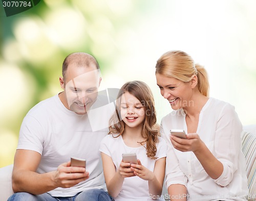 Image of happy family with smartphones