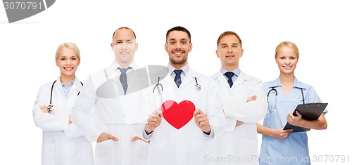 Image of group of smiling doctors with red heart shape