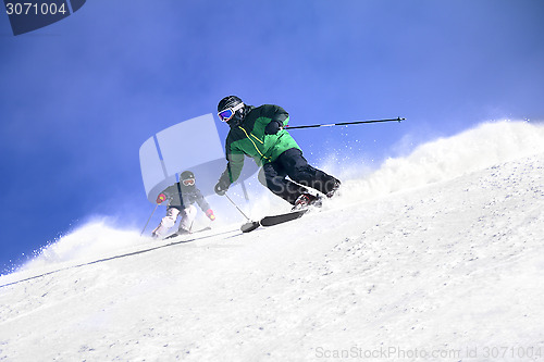 Image of Two Skiers skiing