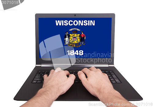 Image of Hands working on laptop, Wisconsin