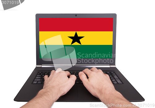 Image of Hands working on laptop, Ghana