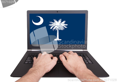 Image of Hands working on laptop, South Carolina