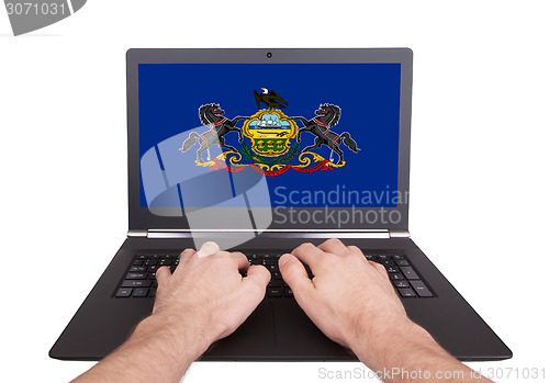 Image of Hands working on laptop, Pennsylvania