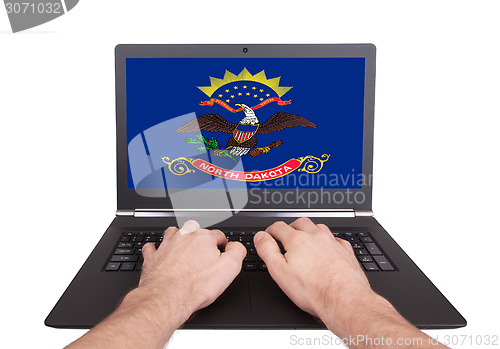 Image of Hands working on laptop, North Dakota