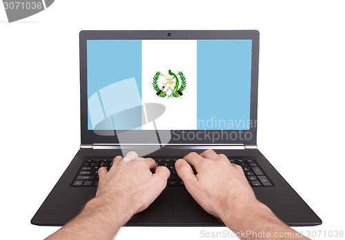 Image of Hands working on laptop, Guatemala