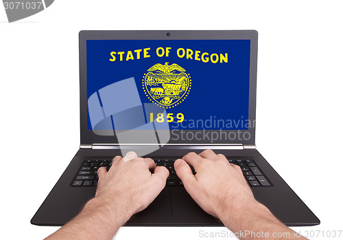 Image of Hands working on laptop, Oregon