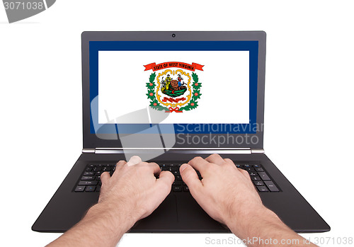 Image of Hands working on laptop, West Virginia