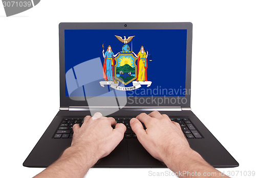 Image of Hands working on laptop, New York