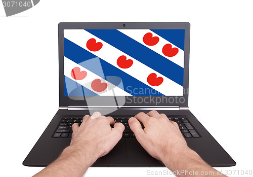 Image of Hands working on laptop, Friesland