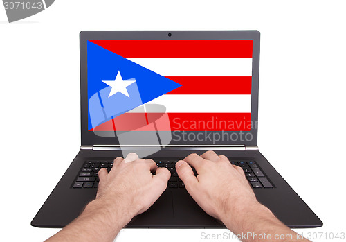 Image of Hands working on laptop, Puerto Rico