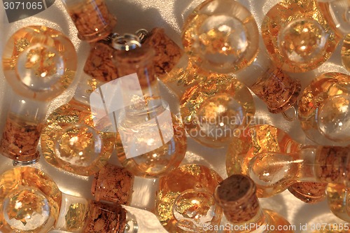 Image of gold in the bottles of water 