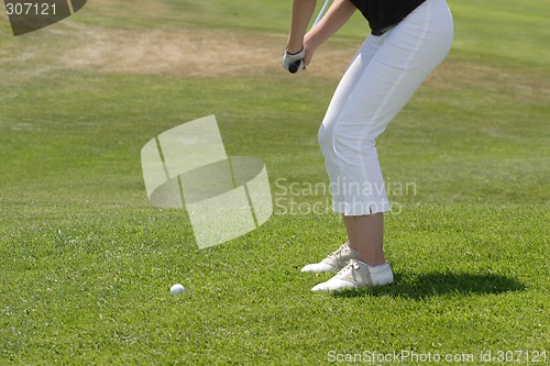 Image of Female golfer playing