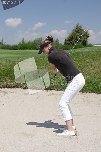 Image of Female golfer playing