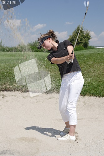 Image of Female golfer playing