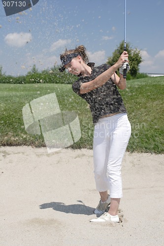 Image of Female golfer playing