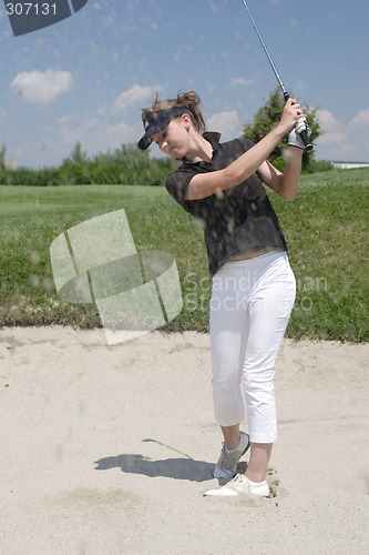 Image of Female golfer playing