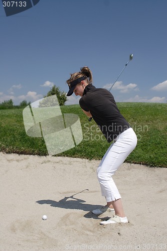 Image of Female golfer playing