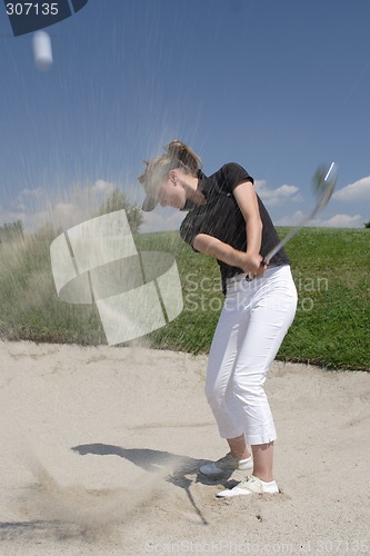 Image of Female golfer playing