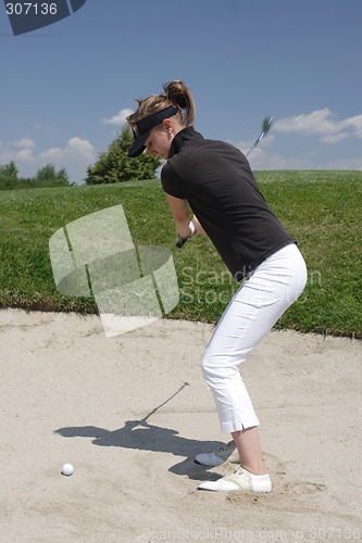 Image of Female golfer playing