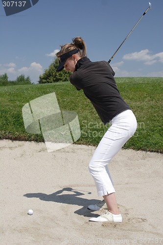 Image of Female golfer playing