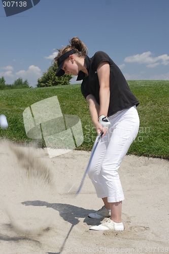 Image of Female golfer playing