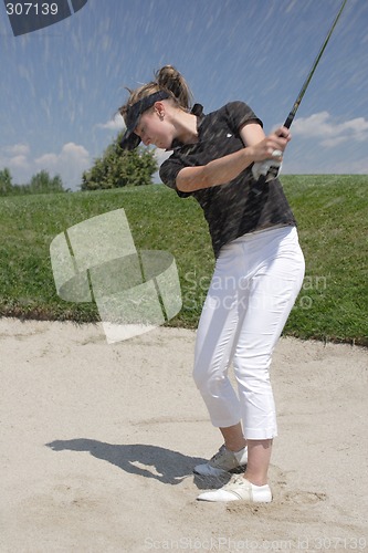 Image of Female golfer playing