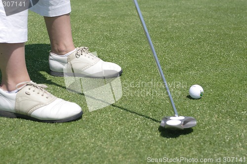 Image of Female golfer playing