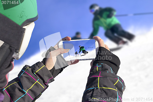 Image of Photographed two skiers with cell phone