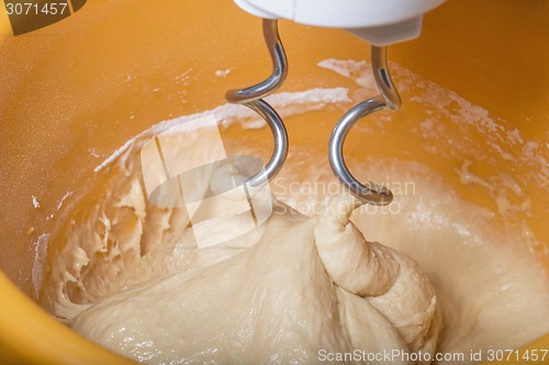 Image of Kneading a dough with a machine 