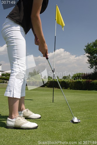 Image of Female golfer playing