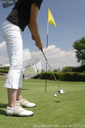 Image of Female golfer playing