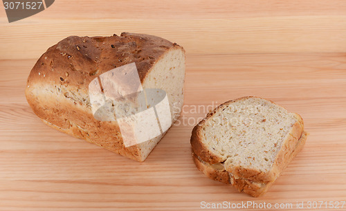 Image of Cut loaf of freshly baked bread with a PB&J sandwich