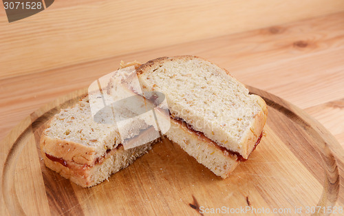 Image of Two homemade peanut butter and jam sandwiches 