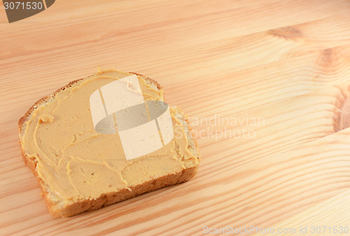 Image of Peanut butter on a slice of bread