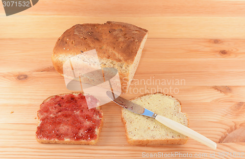 Image of Fresh bread and two slices 