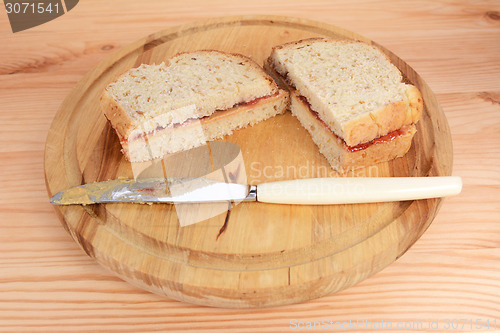 Image of Two homemade PB&J sandwiches 