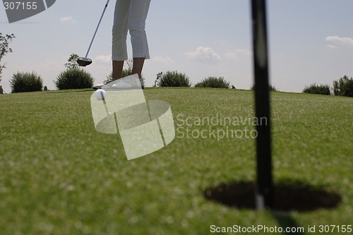 Image of Female golfer playing