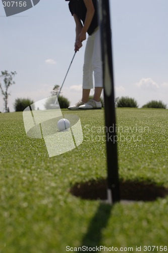 Image of Female golfer playing